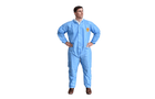 A person wearing a blue Polypropylene Coverall