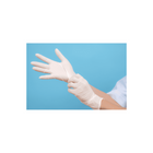 a person wearing white latex gloves